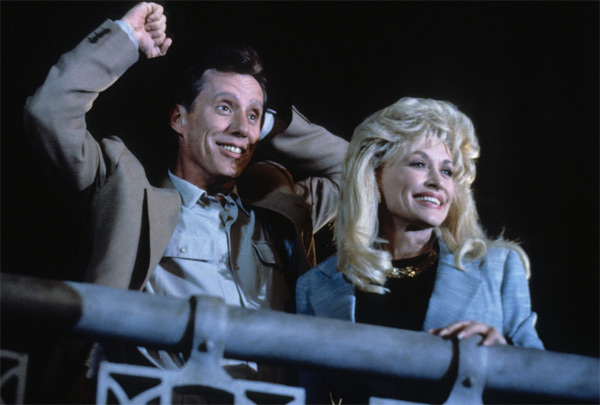 Dolly Parton and James Woods appear in a scene...