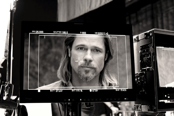 Brad Pitt appears in a behind-the-scenes photo...