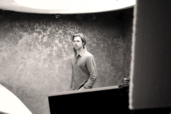 Brad Pitt appears in a behind-the-scenes photo...