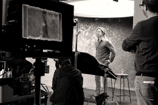 Brad Pitt appears in a behind-the-scenes photo...