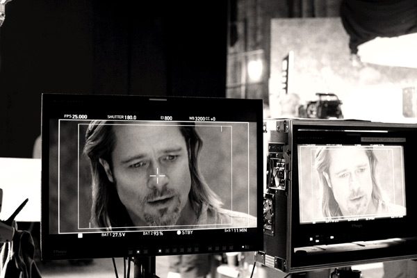 Brad Pitt appears in a behind-the-scenes photo...