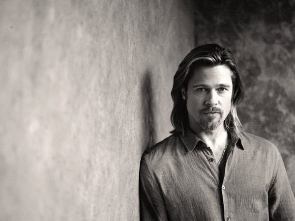 Brad Pitt appears in a behind-the-scenes photo...