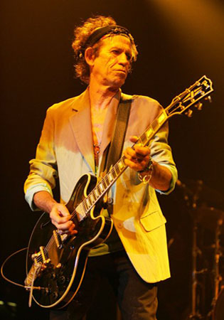 Keith Richards appears in a concert in this...