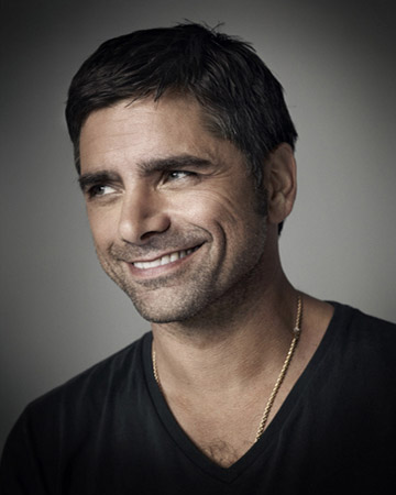 John Stamos in a promotional still from his...