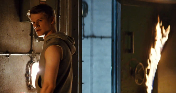 Lucas Till appears as Alex Summers in a scene...