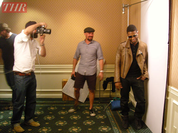 Usher is pictured in a behind-the-scenes photo...
