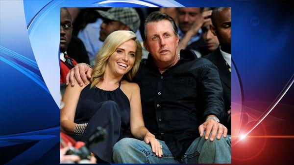 In this May 12, 2009 file photo, golfer Phil Mickelson and his wife, Amy, watch Game 5 of a second-round NBA playoff series between the Los Angeles Lakers and Houston Rockets in Los Angeles, Tuesday, May 12, 2009. Mickelsons wife, Amy, has been diagnosed with breast cancer, and the three-time major champion said Wednesday, May 20, 2009, he will suspend his PGA Tour schedule indefinitely. (AP Photo/Chris Pizzello, File)