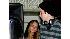 Lindsay Lohan, left, watches backstage as...