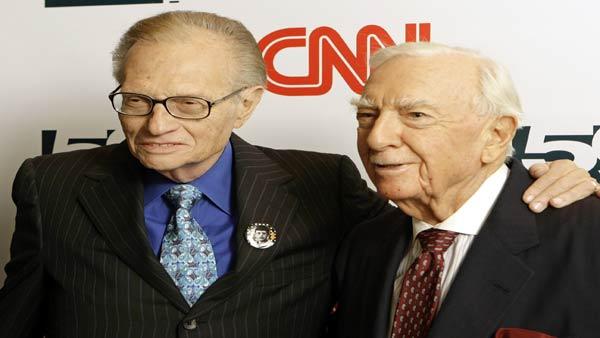 Larry King, left, stands next to Walter Cronkite, right, at a party held by CNN celebrating Kings fifty years of broadcasting, New York, Wednesday, April 18, 2007. ( AP Photo/Stuart Ramson)