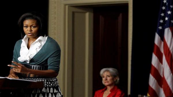 First lady Michelle Obama speaks on health insurance reform and its impact on women and families, Friday, Sept. 18, 2009, in the Eisenhower Executive Office Building on the White House complex in Washington. Health and Human Services Secretary Kathleen Sebelius listens at right.