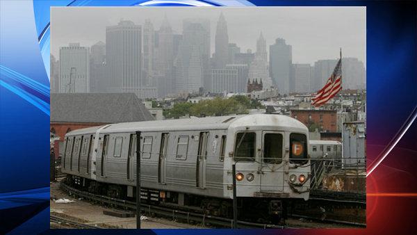 Manhattans downtown skyline is muted in fog as a subway train leaves a Brooklyn station in New York , Friday Oct. 7, 2005. (AP Photo/Bebeto Matthews)