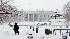 Angela Malone walks in Lafayette Park across...