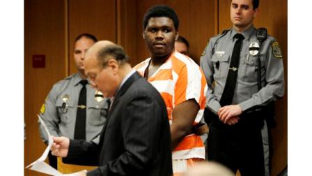 Jahmell Crockam, center, who is accused in the murder of Lakewood Police Officer Christopher Matlosz, stands next to Deputy Public Defender Frank Gonzalez, left, during an appearance before Superior Court Judge Wendel Daniels, not pictured, at the Ocean County Justice Complex, Tuesday, Jan. 18, 2011, in Toms River, N.J. Crockam, 19, was arrested Jan. 16 after a 40-hour manhunt. (AP Photo/Julio Cortez)
