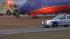 Southwest Airlines plane gets stuck in mud on... ::