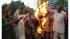 Members of Pakistani Christian community burn an...
