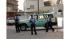 Iraqi policemen stand guard outside Evangelical...