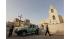 Iraqi policemen stand guard outside Evangelical...