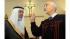 The Rev. Hani Aziz, right, speaks of the one God...