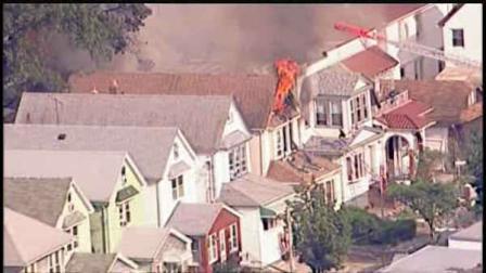 A three alarm fire burned through two homes on 112th Street in Richmond Hill, Queens.