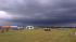 Ominous storm clouds approaching a balloon...
