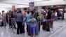 Travelers affected by superstorm Sandy make arrangements at LAX on Tuesday, Oct. 30, 2012.