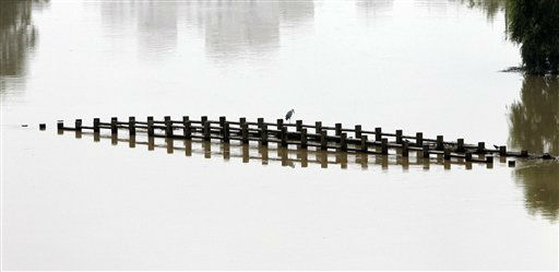Helicopter picks up a load of water to drop on...