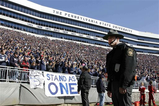 Penn State and Nebraska players gather at...