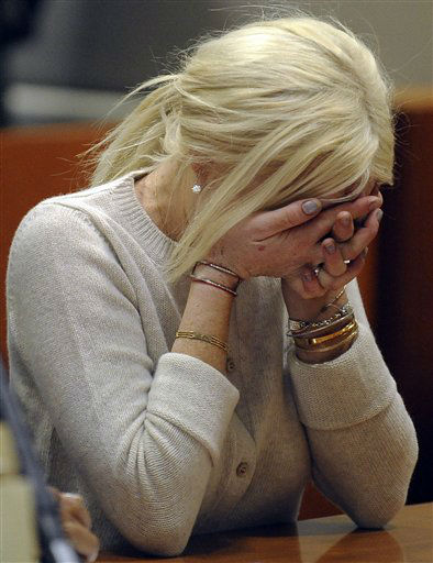 Lindsay Lohan leaves the 10th Precinct, her...