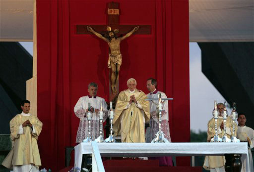 Pope Benedict XVI waves after a prayer the...