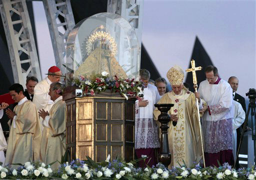 Pope Benedict XVI waves after a prayer the...