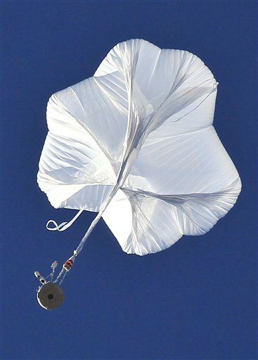 The capsule and attached helium balloon...