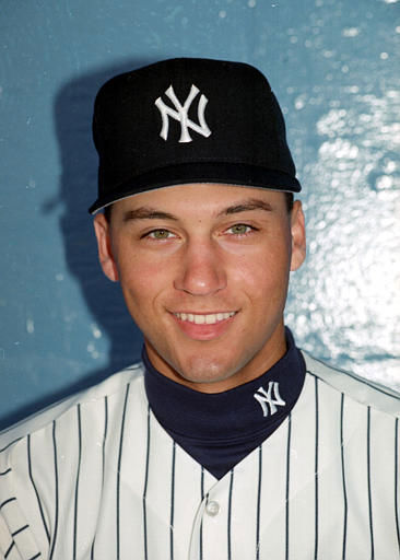 New York Yankees Derek Jeter follows through on...