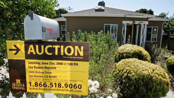 An auction sign is posted at a house under foreclosure in East Palo Alto, Calif., Thursday, June 5, 2008. Home foreclosures and late payments set records over the first three months of the year and are expected to keep rising, stark signs of the housing crisis mounting damage to homeowners and the economy. (AP Photo/Paul Sakuma)