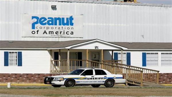 In a Jan. 29, 2009 file photo an Early County Sheriffs car leaves the parking lot at the the Peanut Corporation of America processing plant in Blakely, Ga., Thursday, Jan. 29, 2009. Federal agents on Monday, Feb. 9, 2009, raided the peanut processing plant linked to the nationwide salmonella outbreak that has prompted one of the largest product recalls in U.S. history. (AP Photo/Ric Feld/file)