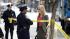 A Police officer (Gameela Wright), left, and...