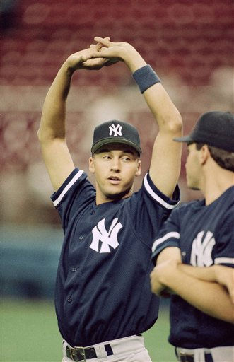 New York Yankees Derek Jeter follows through on...