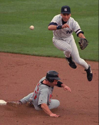 New York Yankees Derek Jeter follows through on...