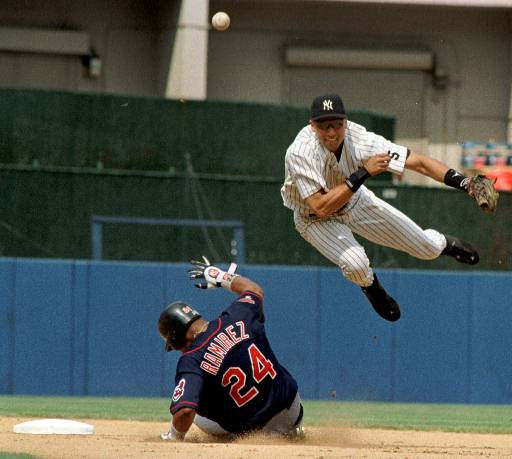 New York Yankees Derek Jeter follows through on...