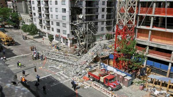 A large crane lies in this intersection on the Upper East Side after it collapsed in this Friday, May 30, 2008 file photo taken in New York. (AP Photo/Dima Gavrysh, File)