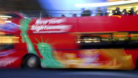 Mayor Bloomberg signs bill to silence open-air buses.