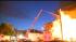 A huge fire burns through a row of houses in... ::