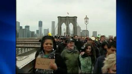 Occupy activists march across Brooklyn Bridge