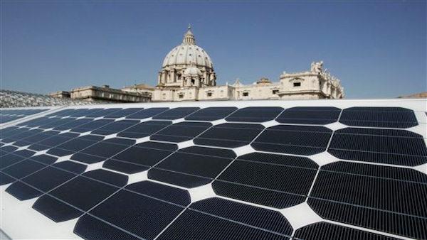 St. Peters Basilica is seen in the background of a solar panel set up on the roof of the Paul VI Hall, at the Vatican, Monday, Sept. 29, 2008. According to the workers involved in the project, a total of 2700 panels will be placed to provide 300,000 kilowatt hours which will be used to illuminate, heat or cool the building where the pontiff holds his general audiences in the winter and in bad weather. Concerts in honor of the pontiff are also staged in the 6,300-seat audience hall. In the background St. Peters Basilica. (AP Photo/Riccardo De Luca)