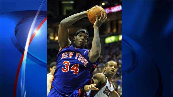 Milwaukee Bucks Lynn Greer, right, tries to defend New York Knicks Eddy Curry, left, in the second half of a basketball game in this Saturday April 7, 2007 file photo, in Milwaukee. Two NBA players robbed of cash and jewelry by masked gunmen and bound with duct tape in separate incidents have detectives in Chicago and a nearby suburb asking if someone is targeting professional athletes. Detectives have not found a link between the robbery of Miami Heat forward Antoine Walker in his Chicago home in early July 2007 and the Saturday, July 28 robbery at the Burr Ridge home of New York Knicks forward Eddy Curry, said Chicago police spokeswoman Monique Bond. (AP Photo/Darren Hauck)
