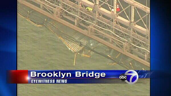 Authorities are examining the bottom of the Brooklyn Bridge after a crane on a passing ship struck the bottom.
