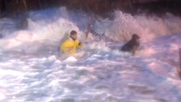 ABC News reporter Matt Gutman (left) and his producer were swept by waves while reporting on superstorm Sandy in North Carolina on Monday, Oct. 29, 2012.