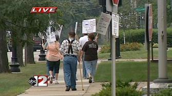 Postal workers protest work transfer plan