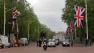 Workers put up a British flag, left, along the Mall, backdropped by Buckingham Palace, in London in preparation for the royal wedding, Tuesday, April 26, 2011. Prince William and Kate Middleton are to marry at Westminster Abbey in London on April 29.