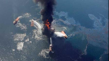 This Wednesday, April 21, 2010 aerial photo shows oil in the Gulf of Mexico, more than 50 miles southeast of Venice on Louisianas tip, as the Deepwater Horizon oil rig burns. The deepwater oil platform that burned for more than day after a massive explosion sank into the Gulf of Mexico on Thursday, April 22, 2010, turning what is likely a deadly blast into an environmental emergency, with the potential for more than 300,000 gallons of crude to foul the waters every day. (AP Photo/Gerald Herbert)