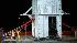 Crew members untie the containment vessel as they prepare to lower it into the Gulf of Mexico at the site of the Deepwater Horizon rig collapse, Thursday, May 6, 2010. (AP Photo/Gerald Herbert)